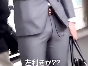 Gay Asian man in a suit in an amateur porn video