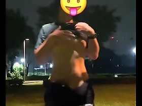 Young man masturbates on a public bike and ejaculates on the street.
