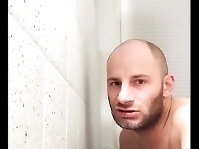 Gay man pleasuring himself with a dildo in the shower