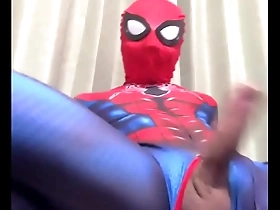 Japanese hunk masturbates with his large penis like Spiderman.