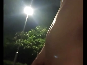 Naked Asian woman in park suffers from high sex drive