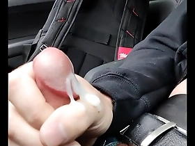 Cum dripping from my hand after a hot bi action in the car