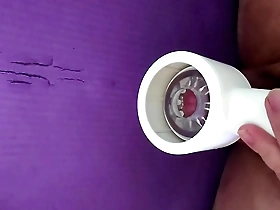 Japanese gay masturbates with a sex toy and has an orgasm.