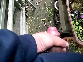 Young Asian man enjoying himself outside in the garden